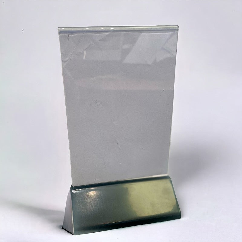 Sign holder incl. A6 acrylic with black plastic base. 10.5 x 6.5 x H 19 cm.