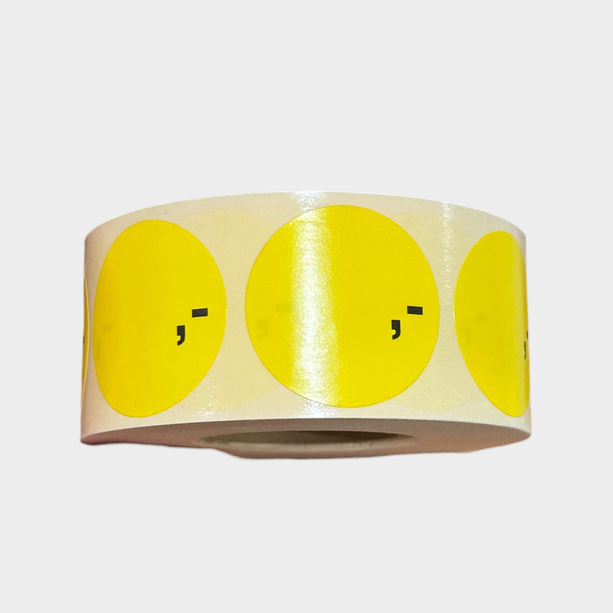 Yellow labels pre-printed ',-' / 1,000 pcs per roll.