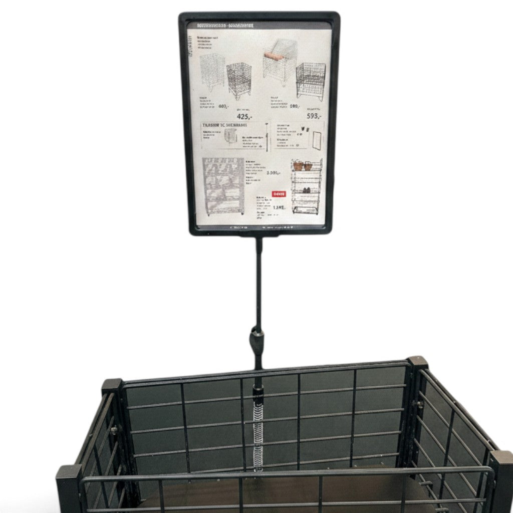 SuperSellerS black A4 sign holder with spring mount attached to a wire basket for retail product display.