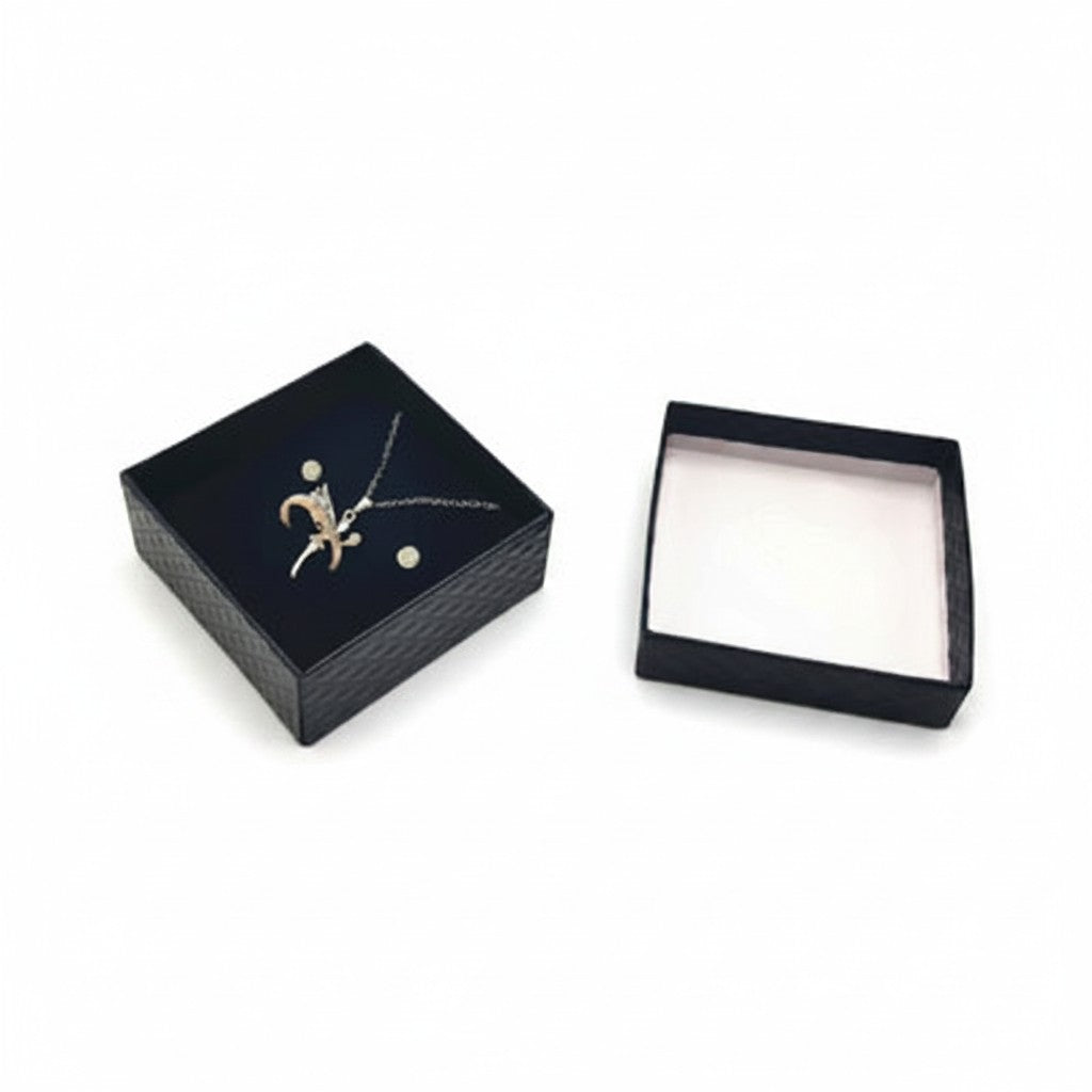 SuperSellerS black embossed paper jewelry box with foam insert holding a necklace, earrings, and ring.
