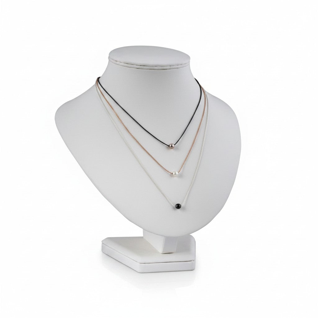 SuperSellerS white faux leather necklace display bust, 24.5 cm tall, showcasing three delicate pendant necklaces.